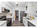 209-290 Plamondon Drive, Fort Mcmurray, AB  - Indoor Photo Showing Kitchen With Stainless Steel Kitchen With Double Sink 