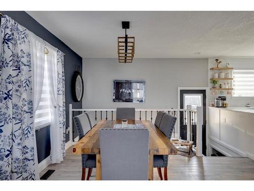 105 Silvertip Place, Fort Mcmurray, AB - Indoor Photo Showing Dining Room With Fireplace