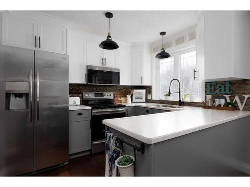 235 Cornwall Drive, Fort Mcmurray, AB - Indoor Photo Showing Kitchen With Double Sink