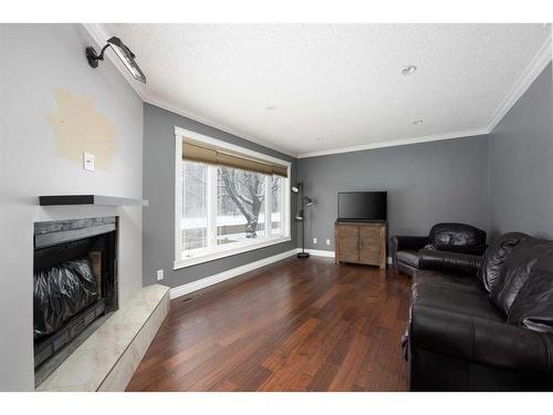 235 Cornwall Drive, Fort Mcmurray, AB - Indoor Photo Showing Living Room With Fireplace