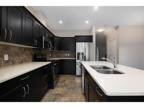 157 Shalestone Way, Fort Mcmurray, AB - Indoor Photo Showing Kitchen With Double Sink With Upgraded Kitchen