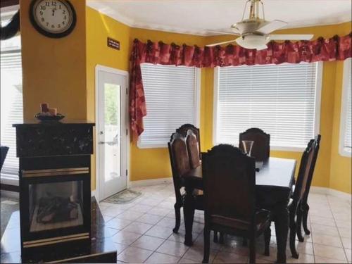 13419 Lakeland Drive, Lac La Biche, AB - Indoor Photo Showing Dining Room With Fireplace