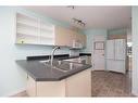 100 Bruin Bay, Fort Mcmurray, AB  - Indoor Photo Showing Kitchen With Double Sink 