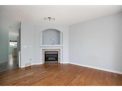 100 Bruin Bay, Fort Mcmurray, AB - Indoor Photo Showing Living Room With Fireplace