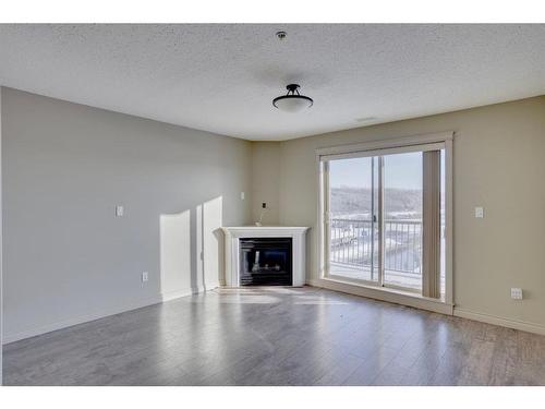 607-8535 Clearwater Drive, Fort Mcmurray, AB - Indoor Photo Showing Living Room With Fireplace