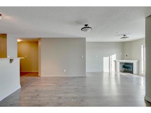 607-8535 Clearwater Drive, Fort Mcmurray, AB - Indoor Photo Showing Living Room With Fireplace