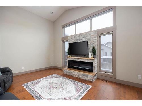 113 Red Lily Gate, Fort Mcmurray, AB - Indoor Photo Showing Living Room With Fireplace