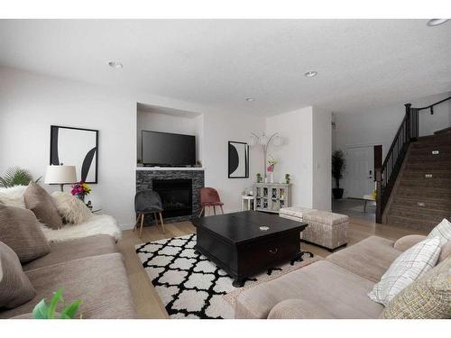 145 Shalestone Place, Fort Mcmurray, AB - Indoor Photo Showing Living Room With Fireplace