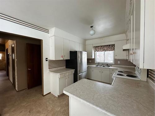 601-67061 Mission Road, Lac La Biche, AB - Indoor Photo Showing Kitchen With Double Sink