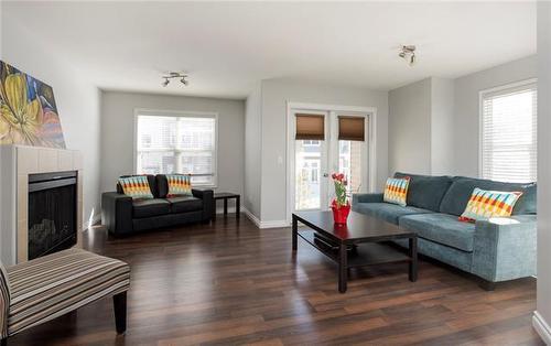 36-180 Riverstone Ridge, Fort Mcmurray, AB - Indoor Photo Showing Living Room With Fireplace