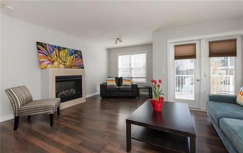 36-180 Riverstone Ridge, Fort Mcmurray, AB - Indoor Photo Showing Living Room With Fireplace