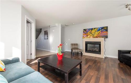 36-180 Riverstone Ridge, Fort Mcmurray, AB - Indoor Photo Showing Living Room With Fireplace