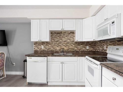 101-248B Grosbeak Way, Fort Mcmurray, AB - Indoor Photo Showing Kitchen With Double Sink