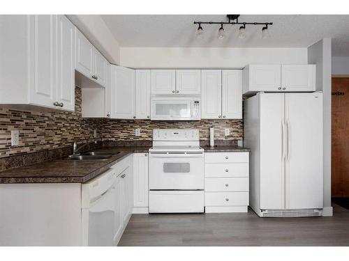 101-248B Grosbeak Way, Fort Mcmurray, AB - Indoor Photo Showing Kitchen With Double Sink