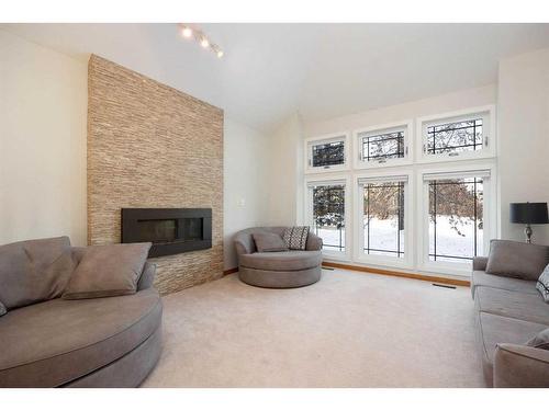 105 Silverdale Garden Sw, Fort Mcmurray, AB - Indoor Photo Showing Living Room With Fireplace