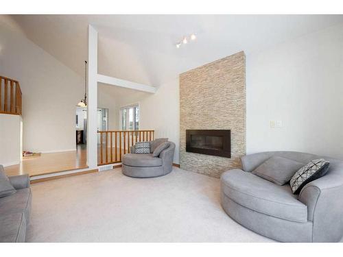 105 Silverdale Garden Sw, Fort Mcmurray, AB - Indoor Photo Showing Living Room With Fireplace