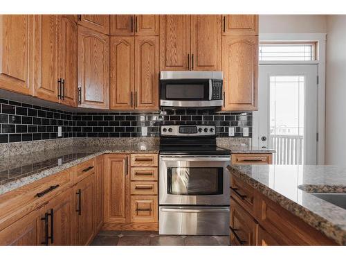 124 Woodpecker Green, Fort Mcmurray, AB - Indoor Photo Showing Kitchen With Stainless Steel Kitchen With Upgraded Kitchen