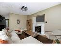 221 Crown Creek Lane, Fort Mcmurray, AB  - Indoor Photo Showing Living Room With Fireplace 