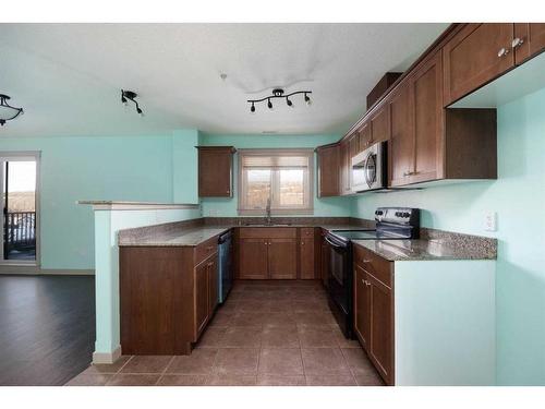 204-8535 Clearwater Drive, Fort Mcmurray, AB - Indoor Photo Showing Kitchen With Double Sink