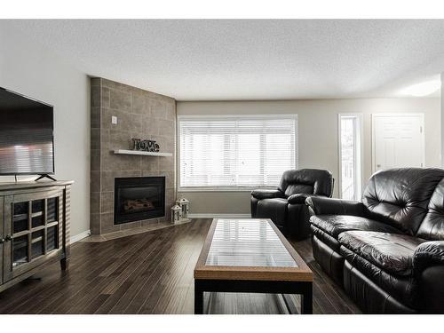 120 Sirius Avenue, Fort Mcmurray, AB - Indoor Photo Showing Living Room With Fireplace