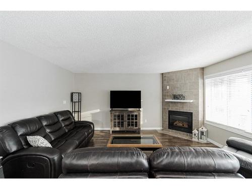 120 Sirius Avenue, Fort Mcmurray, AB - Indoor Photo Showing Living Room With Fireplace