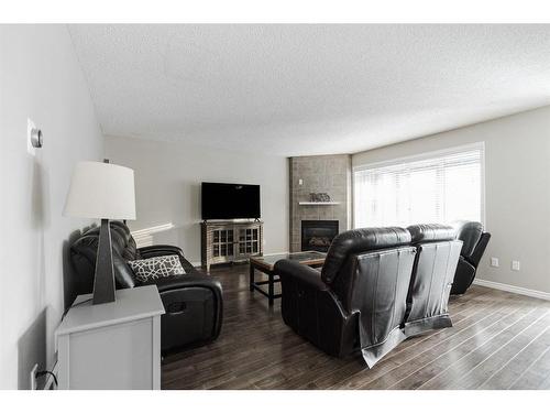 120 Sirius Avenue, Fort Mcmurray, AB - Indoor Photo Showing Living Room With Fireplace