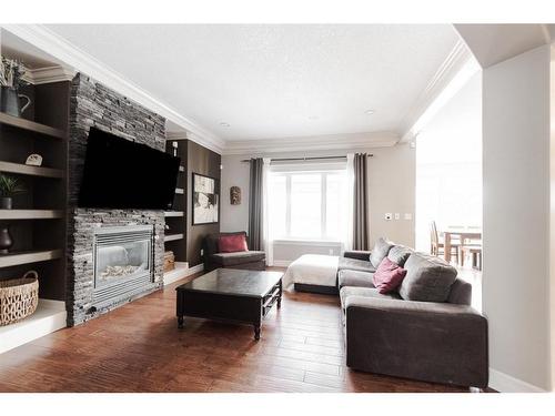 788 Heritage Drive, Fort Mcmurray, AB - Indoor Photo Showing Living Room With Fireplace