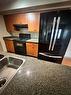 305-10115 Morrison Street, Fort Mcmurray, AB  - Indoor Photo Showing Kitchen With Double Sink 