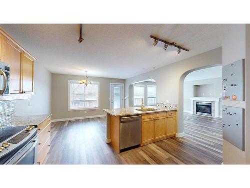 315 Warren Road, Fort Mcmurray, AB - Indoor Photo Showing Kitchen With Fireplace