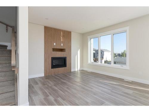 149 Shalestone Place, Fort Mcmurray, AB - Indoor Photo Showing Living Room With Fireplace