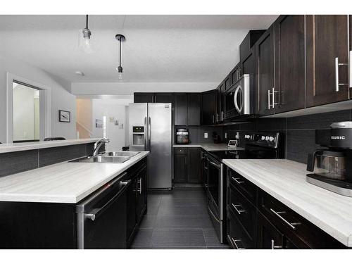 15-400 Sparrow Hawk Drive, Fort Mcmurray, AB - Indoor Photo Showing Kitchen With Double Sink