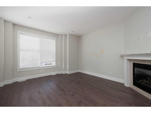 10-401 Sparrow Hawk Drive, Fort Mcmurray, AB - Indoor Photo Showing Other Room With Fireplace