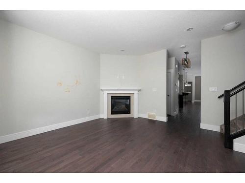 10-401 Sparrow Hawk Drive, Fort Mcmurray, AB - Indoor Photo Showing Living Room With Fireplace