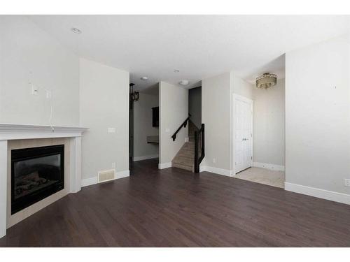 10-401 Sparrow Hawk Drive, Fort Mcmurray, AB - Indoor Photo Showing Living Room With Fireplace