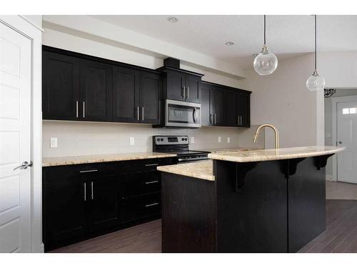 10-401 Sparrow Hawk Drive, Fort Mcmurray, AB - Indoor Photo Showing Kitchen With Upgraded Kitchen