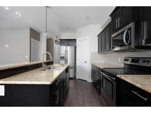 10-401 Sparrow Hawk Drive, Fort Mcmurray, AB - Indoor Photo Showing Kitchen With Double Sink With Upgraded Kitchen