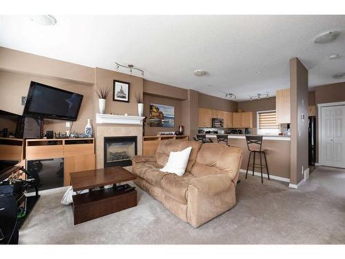 44-313 Millennium Drive, Fort Mcmurray, AB - Indoor Photo Showing Living Room With Fireplace