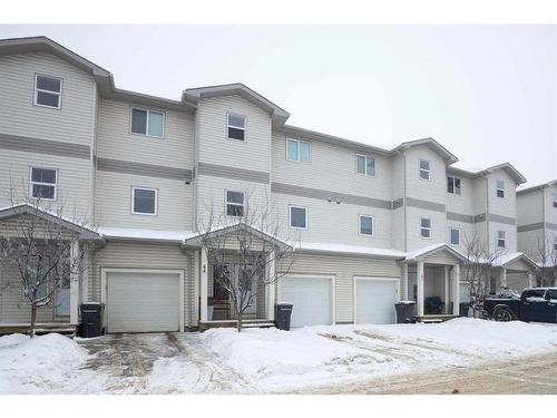 44-313 Millennium Drive, Fort Mcmurray, AB - Outdoor With Facade