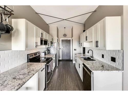 309-8026 Franklin Avenue, Fort Mcmurray, AB - Indoor Photo Showing Kitchen With Stainless Steel Kitchen With Double Sink With Upgraded Kitchen