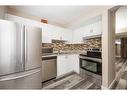 155D Dickins, Fort Mcmurray, AB  - Indoor Photo Showing Kitchen With Double Sink With Upgraded Kitchen 