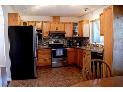 233 Barber Drive, Fort Mcmurray, AB - Indoor Photo Showing Kitchen With Double Sink