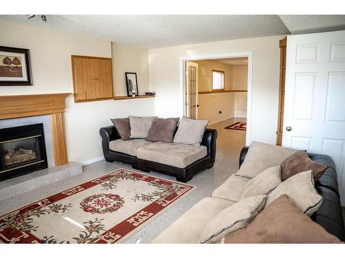 233 Barber Drive, Fort Mcmurray, AB - Indoor Photo Showing Living Room With Fireplace