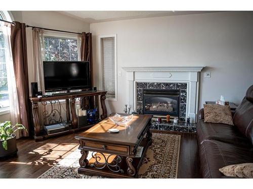 233 Barber Drive, Fort Mcmurray, AB - Indoor Photo Showing Living Room With Fireplace