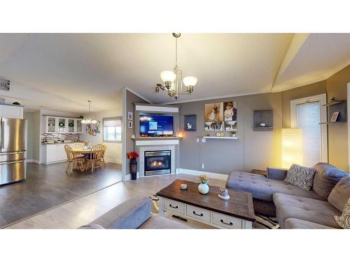 213 Waterhouse Street, Fort Mcmurray, AB - Indoor Photo Showing Living Room With Fireplace