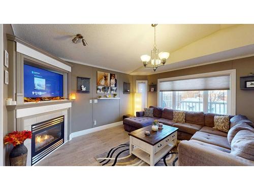 213 Waterhouse Street, Fort Mcmurray, AB - Indoor Photo Showing Living Room With Fireplace