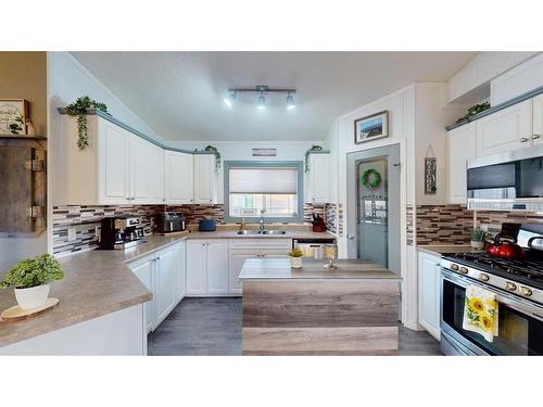 213 Waterhouse Street, Fort Mcmurray, AB - Indoor Photo Showing Kitchen With Double Sink