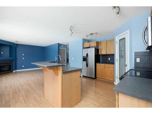 144 Violet Street, Fort Mcmurray, AB - Indoor Photo Showing Kitchen With Fireplace