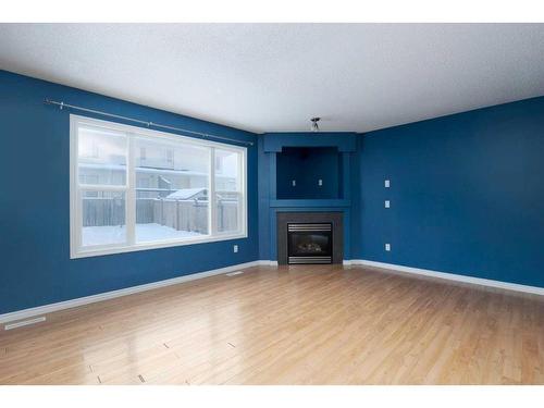 144 Violet Street, Fort Mcmurray, AB - Indoor Photo Showing Living Room With Fireplace