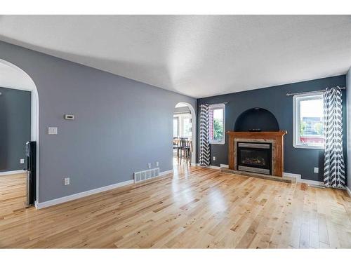 173 Pickles Crescent, Fort Mcmurray, AB - Indoor Photo Showing Living Room With Fireplace