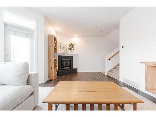 23-97 Wilson Drive, Fort Mcmurray, AB - Indoor Photo Showing Living Room With Fireplace